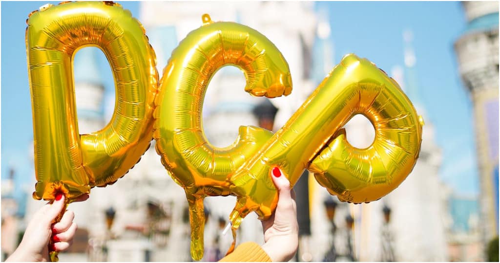 DCP balloons in front of Magic Kingdom.